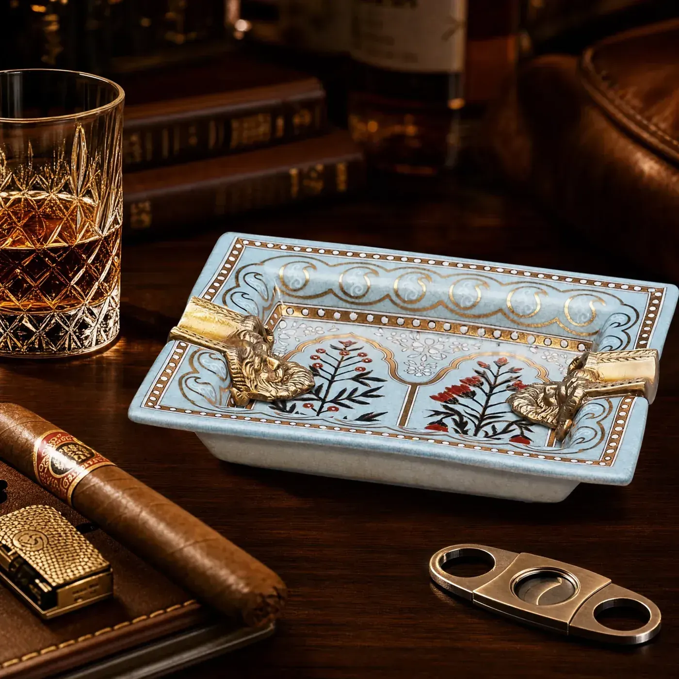 Powder-blue ceramic cigar ashtray with sculpted gold rests for club programmes