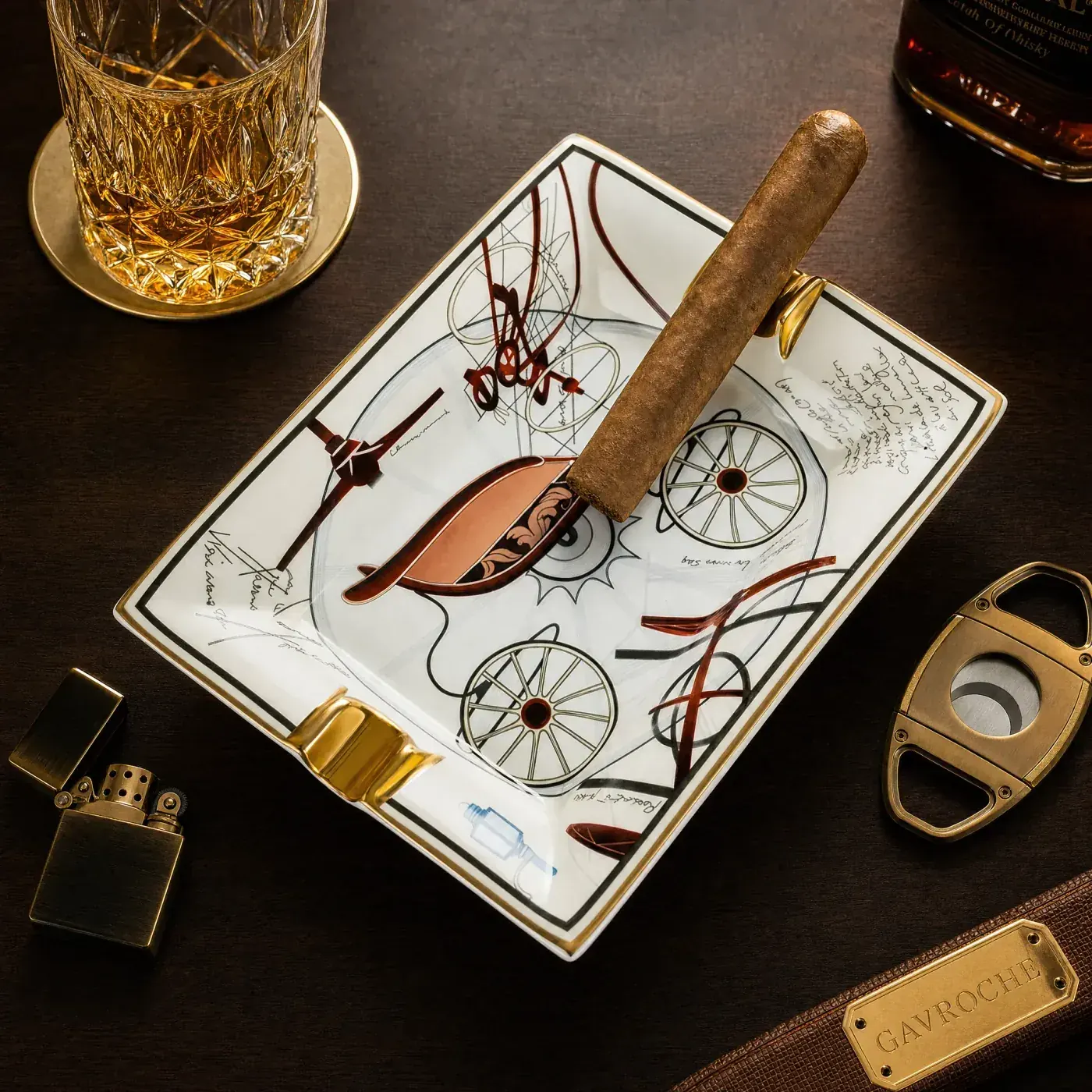 White ceramic cigar ashtray with sketch artwork and gold rests for branded programmes
