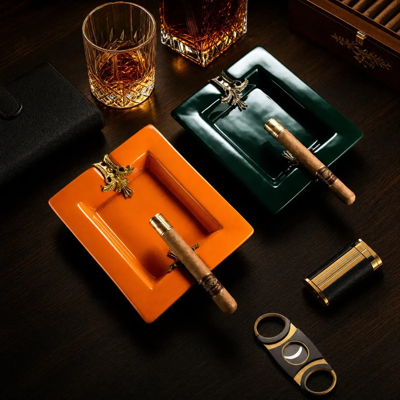 Orange and green ceramic cigar ashtrays with crest rests for colourway programmes