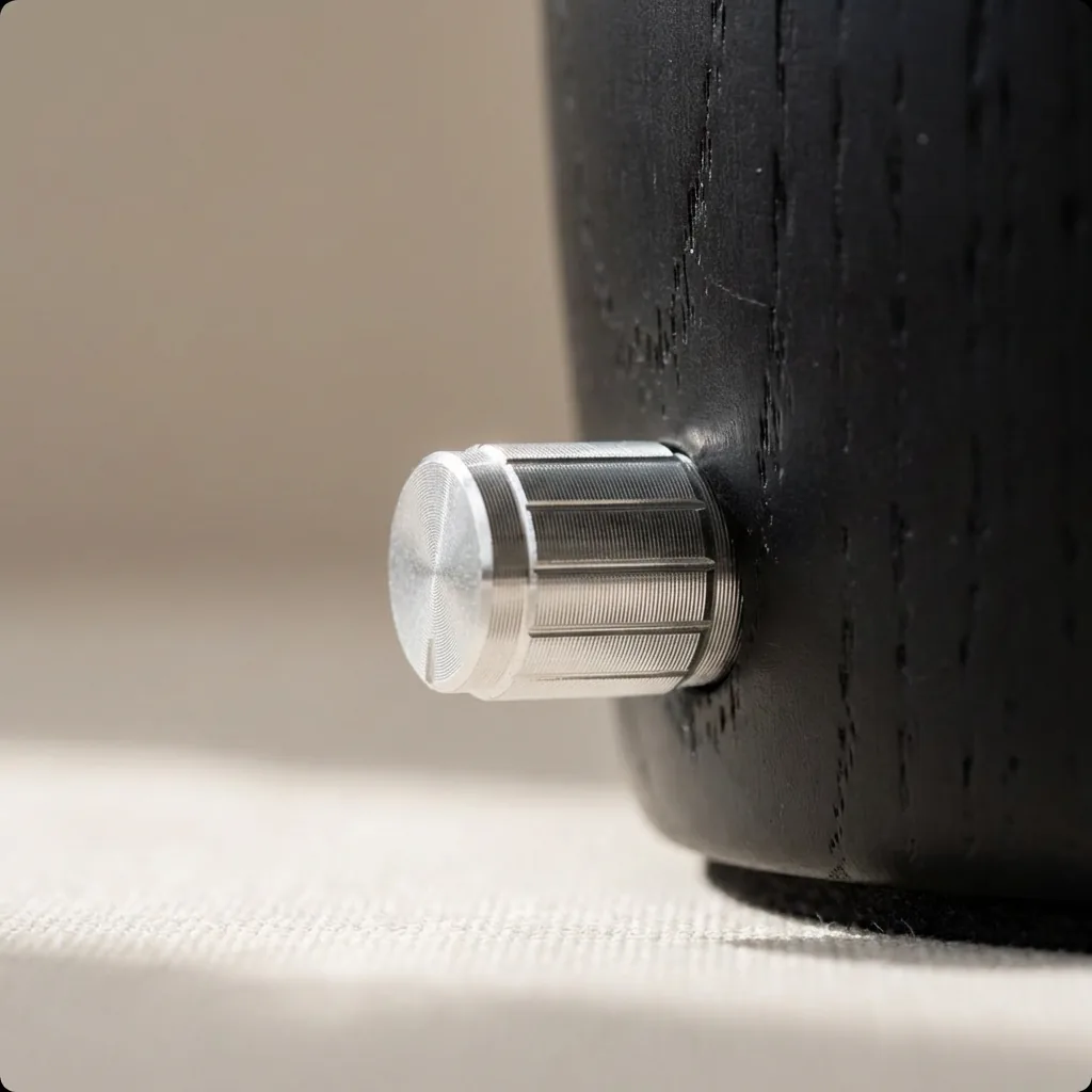 Knurled silver metal control knob set into a dark wood dual-fluid aroma diffuser base
