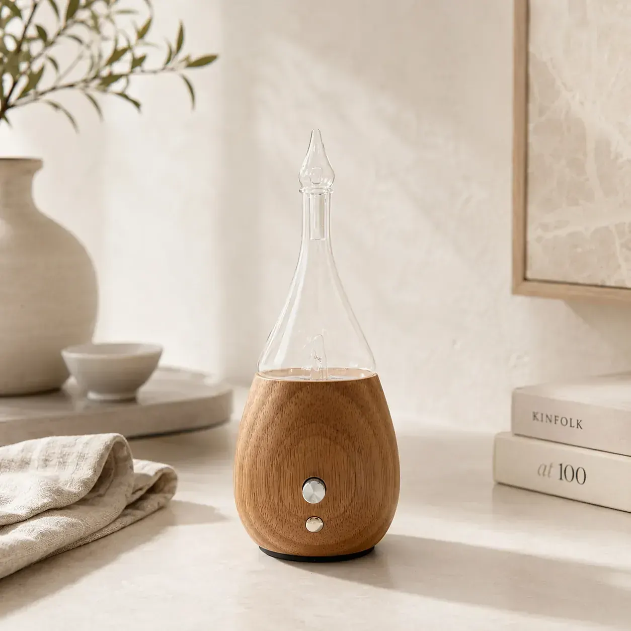 Teardrop wood-and-glass dual-fluid aroma diffuser in a minimalist lifestyle setting