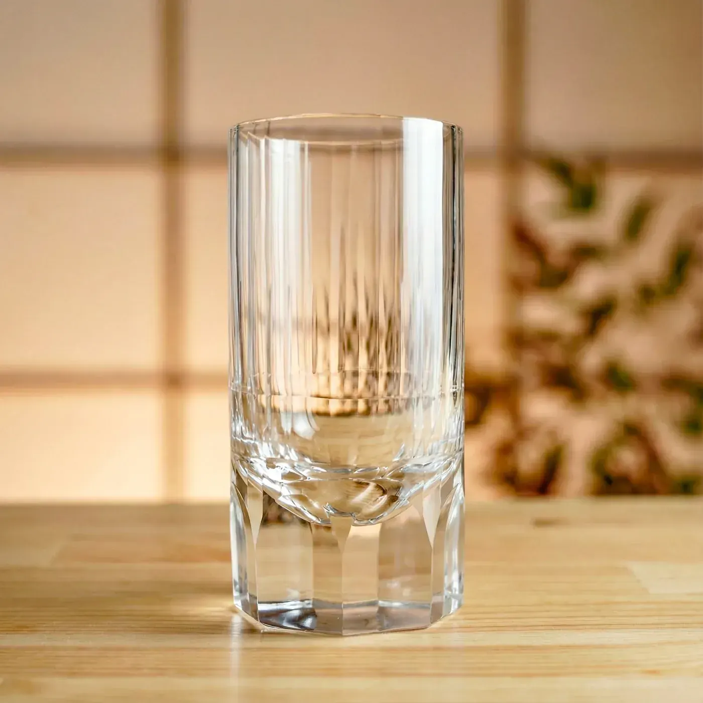 Tall clear Edo Kiriko tumbler with vertical ridges and hexagonal base facets