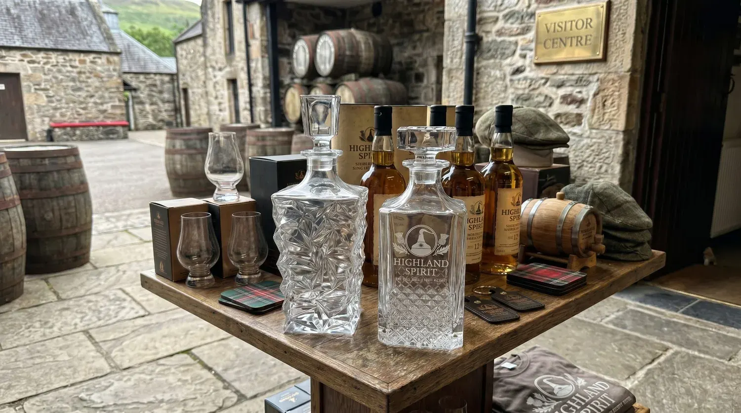 Branded whiskey decanter displayed at a distillery tasting counter