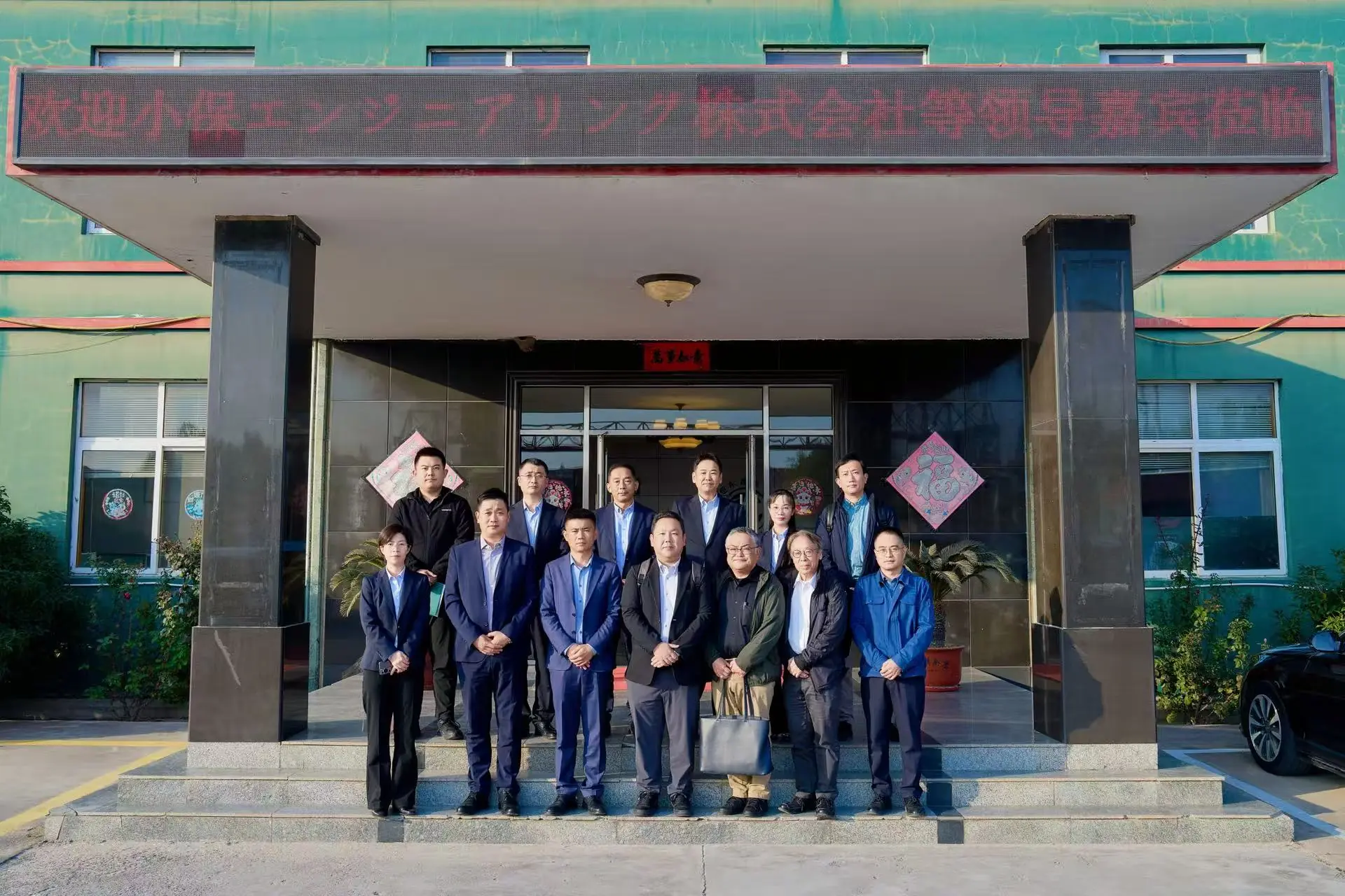 Morika team and manufacturing partners outside a Qingdao partner workshop