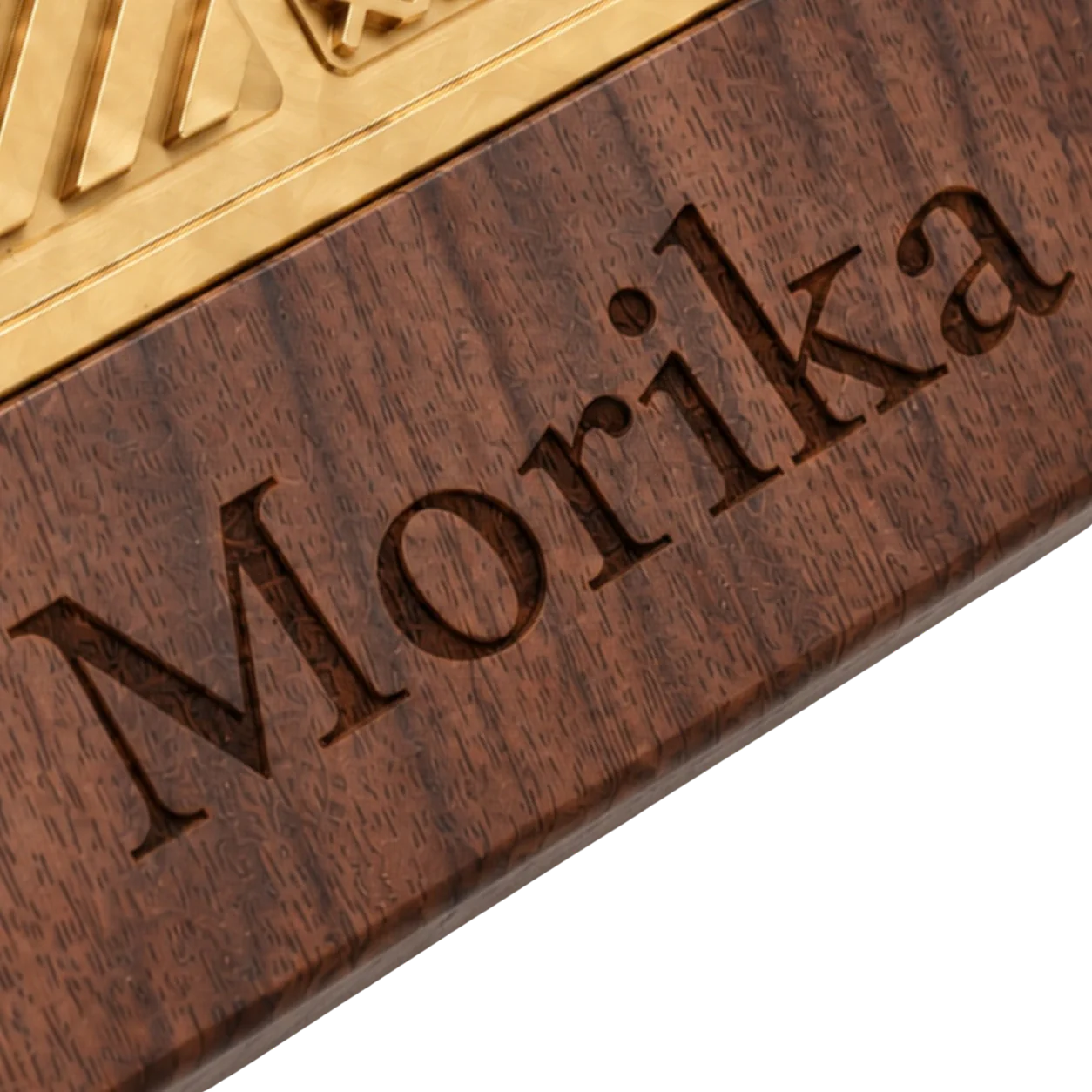Close view of a black walnut ice branding stamp base with a laser-engraved brand mark